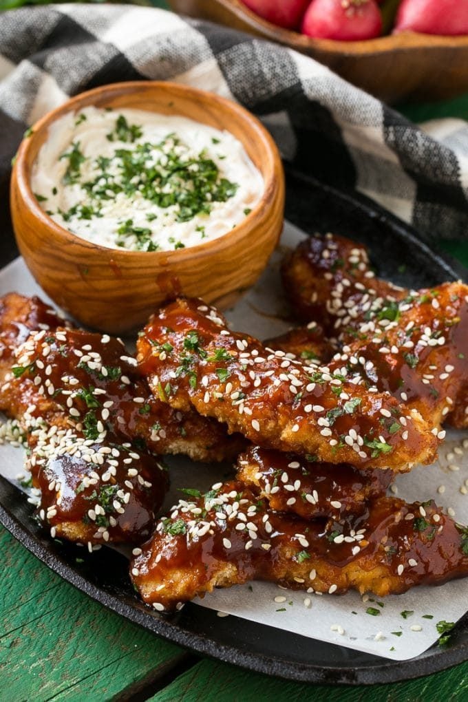 Baked chicken fingers served with sesame dip.