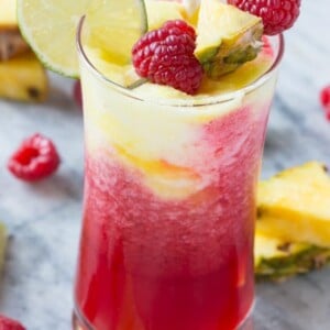 This sparkling raspberry pineapple freeze is a festive and refreshing drink that takes just minutes to put together. #WaterMadeExciting Ad