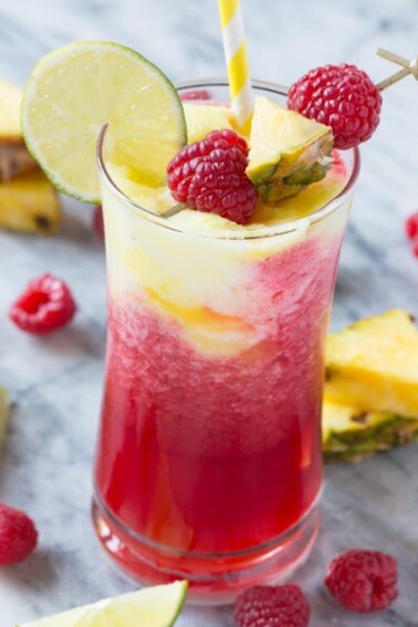 This sparkling raspberry pineapple freeze is a festive and refreshing drink that takes just minutes to put together. #WaterMadeExciting Ad