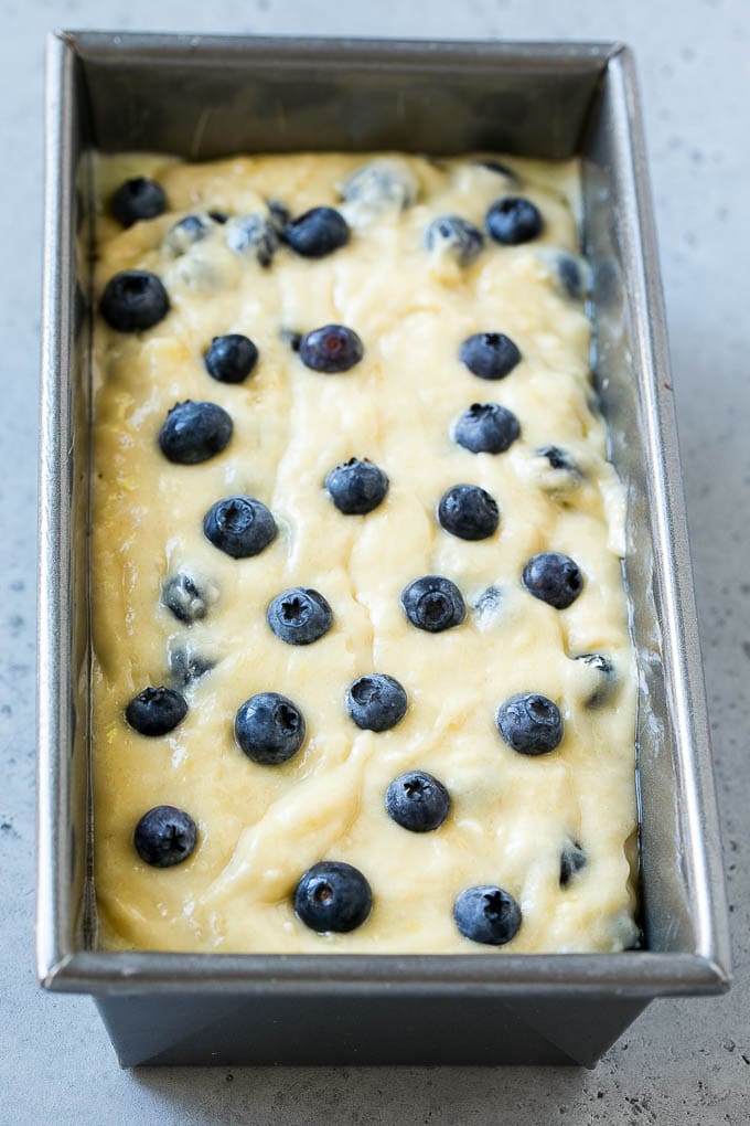 Blueberry banana bread batter in a loaf pan.