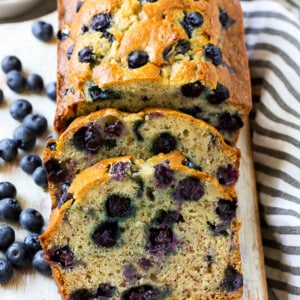 A loaf of sliced blueberry banana bread.