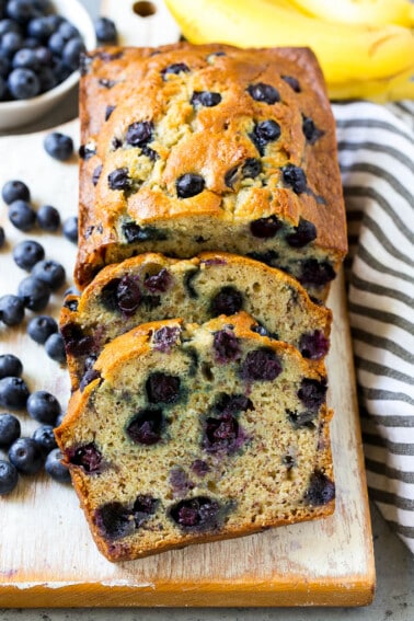 A loaf of sliced blueberry banana bread.