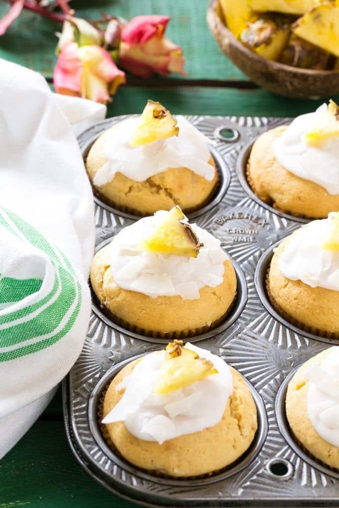 Pineapple muffins in a baking tin.