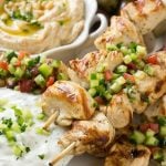 This recipe for greek chicken souvlaki is skewers of tender chicken breast marinated in lemon, garlic and herbs, then grilled to perfection and served with a creamy yogurt sauce. FosterFarmsOrganic AD