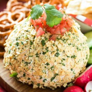This Jalapeno Cheddar Cheese Ball is full of zesty Mexican flavor and takes just minutes to make. The perfect snack for game day! #KickUpTheFlavor Ad