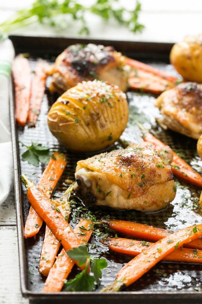 A pan of maple dijon chicken, potatoes and carrots.