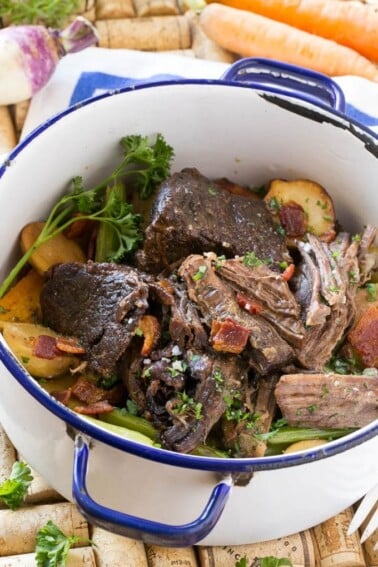 This Yankee Pot Roast is a beef roast that's been braised to meltingly tender perfection, seasoned with bacon, and served with potatoes and vegetables. A hearty and comforting meal all in one pot!