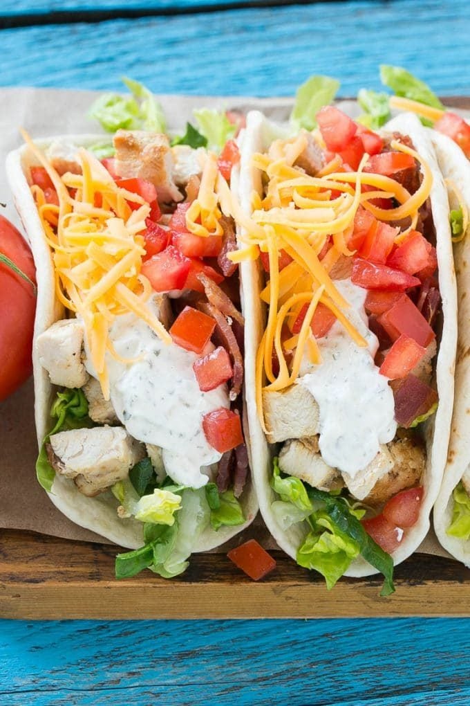 Chicken ranch tacos filled with bacon, cheese and tomatoes.