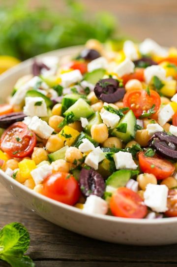This recipe for chopped greek salad is a variety of fresh vegetables with chickpeas, creamy feta cheese and olives, all tossed in a greek lemon and herb vinaigrette.