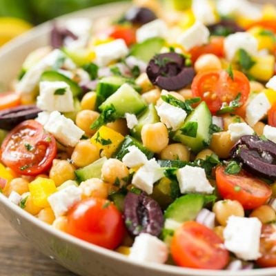 This recipe for chopped greek salad is a variety of fresh vegetables with chickpeas, creamy feta cheese and olives, all tossed in a greek lemon and herb vinaigrette.