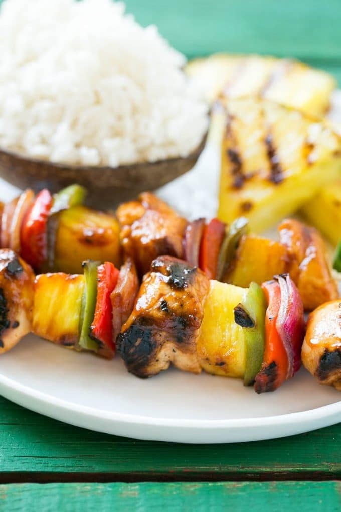 Hawaiian chicken kabobs served with coconut rice.