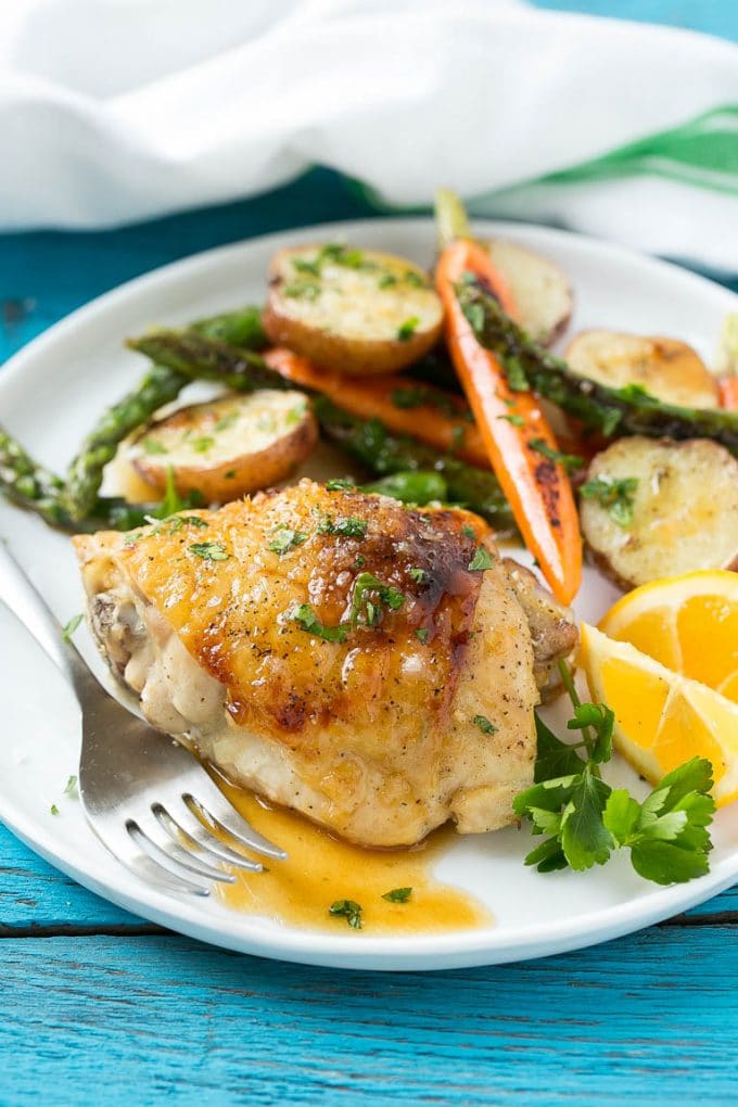 A plate with lemon thyme chicken, vegetables and potatoes.