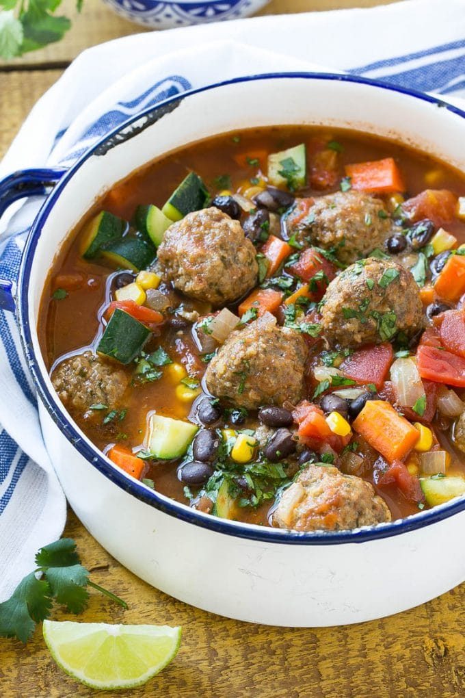 Meatball soup with spiced beef meatballs, black beans and vegetables in a tomato broth.