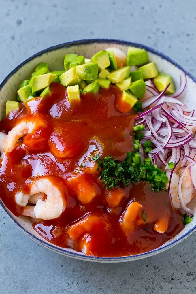 Shrimp, avocado, red onion and cilantro topped with cocktail sauce.