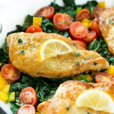 This recipe for Pan Seared Chicken Breast with Spinach is a one pot meal of chicken breasts and vegetables in the most delicious lemon, butter and herb sauce.