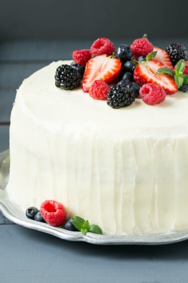This recipe for berry chantilly cake is a light and yellow cake with plenty of fresh berries and a unique fluffy whipped cream frosting. The perfect cake for a celebration! #BRMEaster #CleverGirls