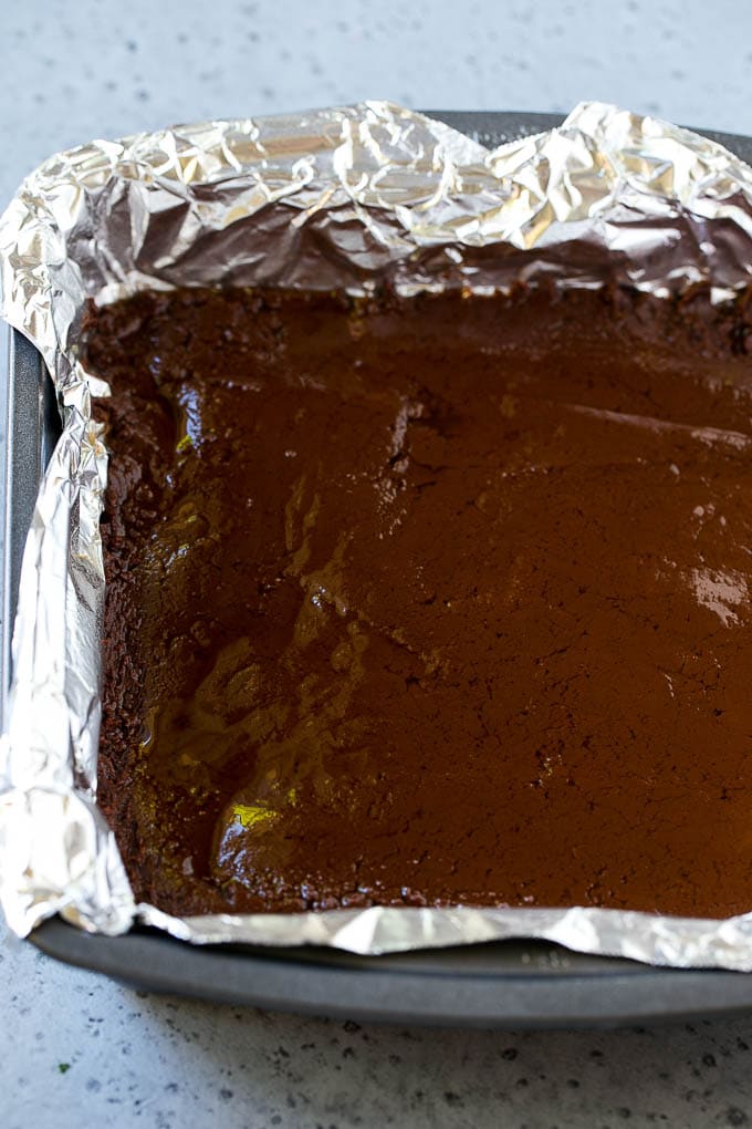 A layer of chocolate fudge in a pan.