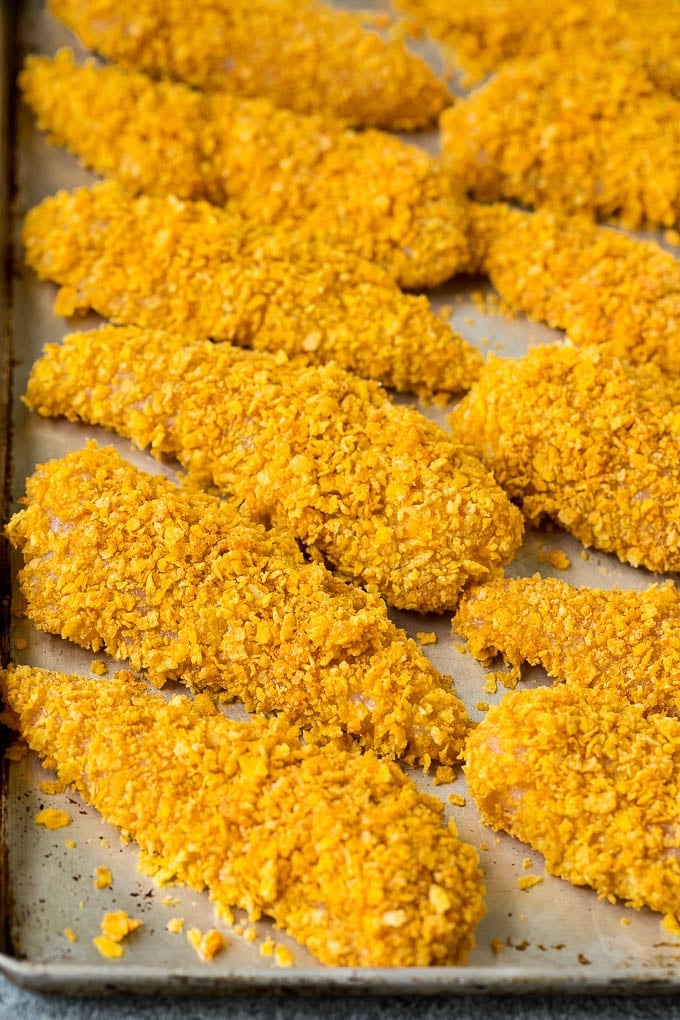 Chicken tenders rolled in crushed cornflakes.