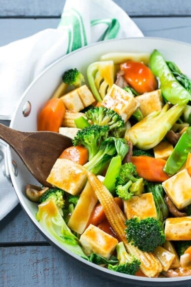 This recipe for Buddha's Delight is a classic Asian dish full of mixed vegetables and tofu in a savory sauce. Male you own take out in less than 30 minutes! #soyfoodsmonth #ad
