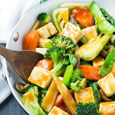 This recipe for Buddha's Delight is a classic Asian dish full of mixed vegetables and tofu in a savory sauce. Male you own take out in less than 30 minutes! #soyfoodsmonth #ad