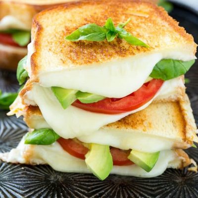 This caprese sandwich recipe is the classic combination of tomatoes, mozzarella and basil with the welcome addition of avocado slices, all sandwiched together between slices of buttery toasted bread. ArtesanoBread AD