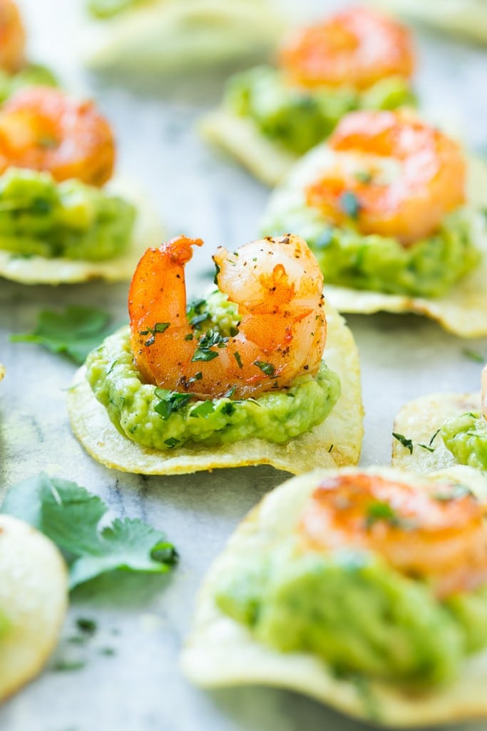 Mexican shrimp bites with spiced shrimp on top of potato chips.