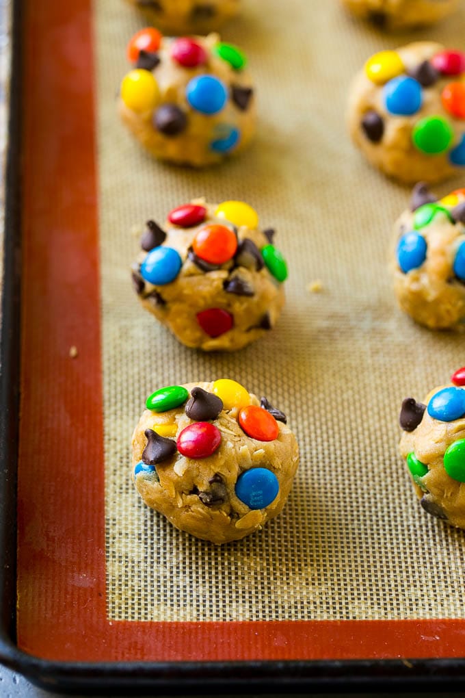 Balls of cookie dough on a baking sheet.