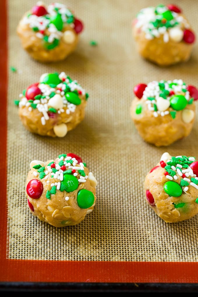 Balls of cookie dough on a baking sheet.