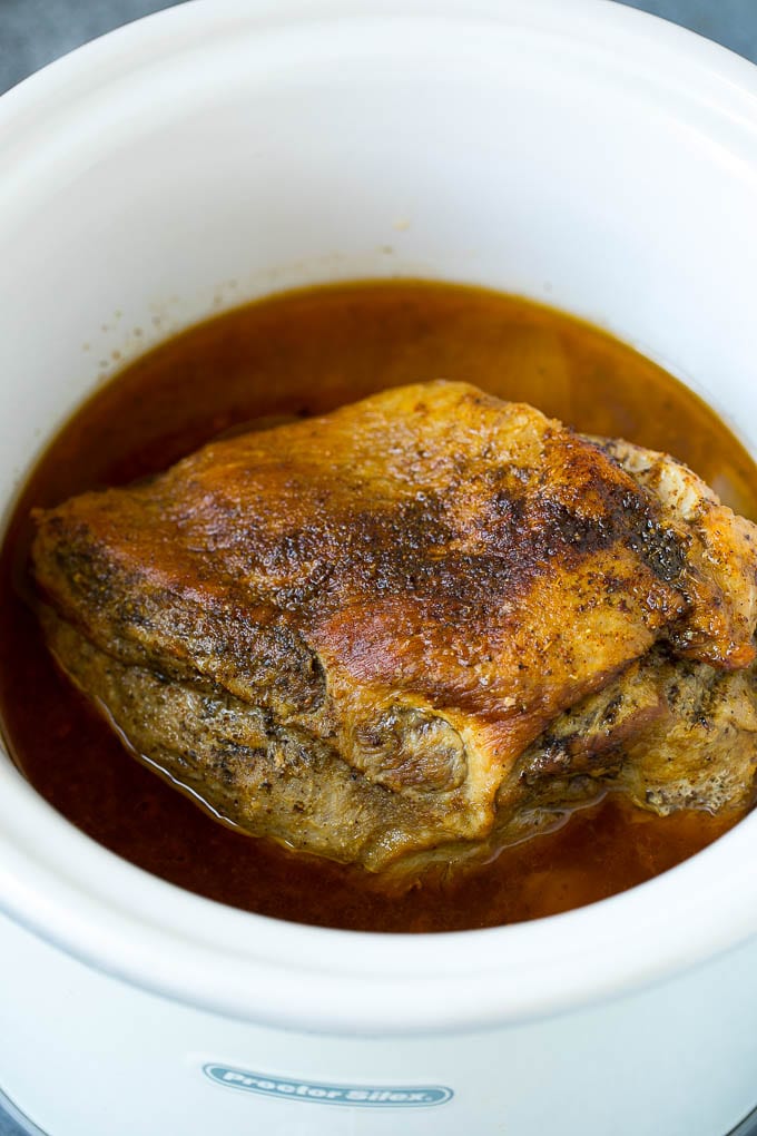 A cooked pork roast in the slow cooker.