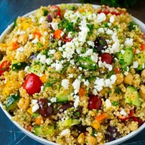 Quinoa salad with tomatoes, cucumbers, peppers, onions and olives.