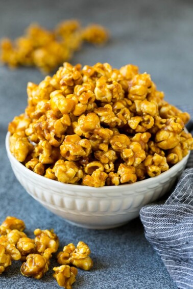 A serving bowl filled with caramel popcorn.