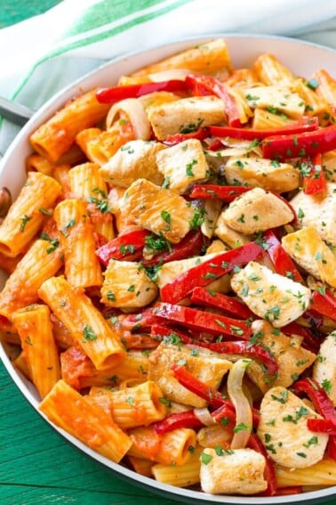 This recipe for chicken riggies is sauteed chicken with peppers and rigatoni pasta, all tossed in a creamy tomato sauce. This spicy chicken rigatoni dish is pure comfort food and can easily be doubled to serve a crowd! #ad