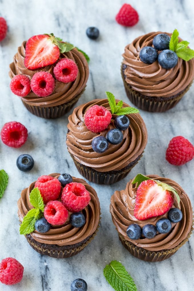 This recipe for chocolate hazelnut cupcakes is chocolate cupcakes filled with milk chocolate hazelnut spread, then finished off with chocolate hazelnut frosting and fresh berries. The perfect treat for a special occasion! #chocmeister #chocolatehazelnut #ad