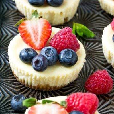 This recipe for Greek yogurt cheesecakes is mini cheesecakes that have been lightened up with Greek yogurt and topped with fresh berries. A quick and easy sweet treat! #CloverGreekYogurt ad