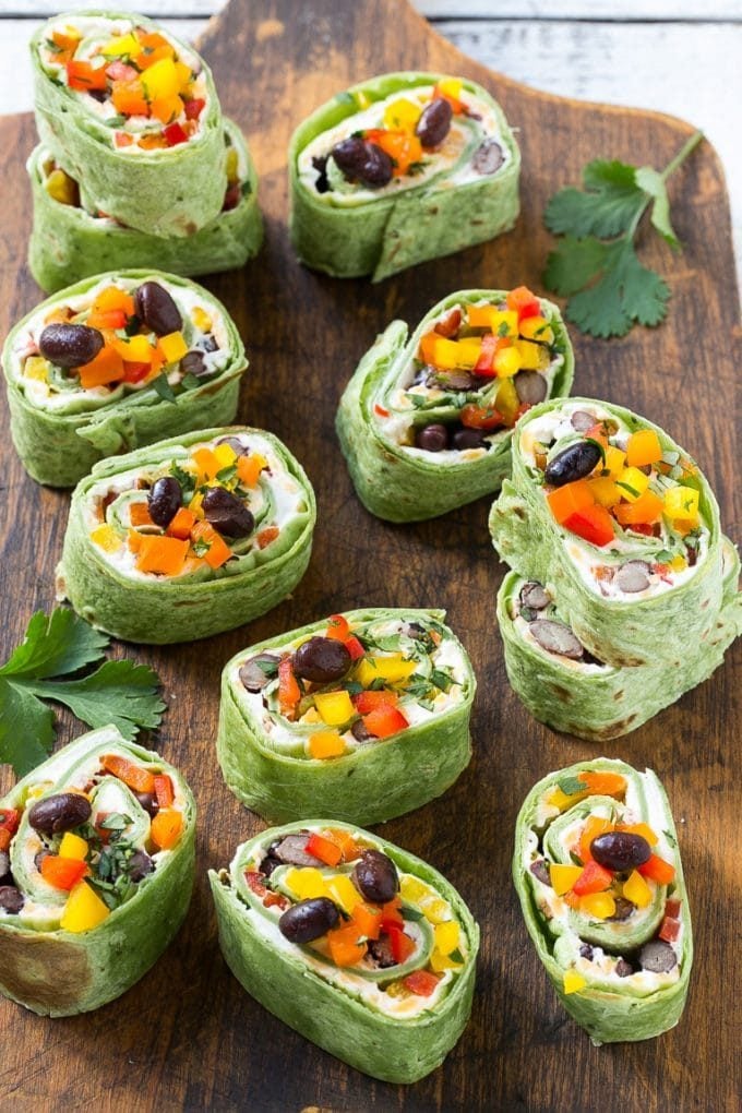 Tortilla pinwheels with a filling of cream cheese, black beans, bell peppers and seasonings.