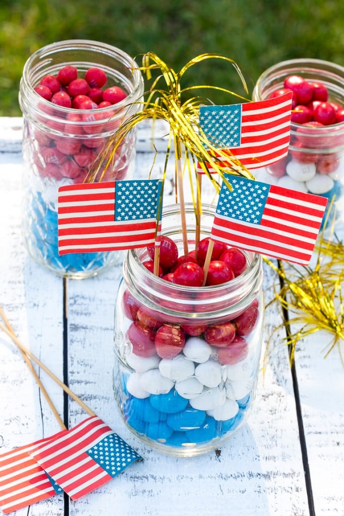 Centerpieces made with layers of red white and blue candy.