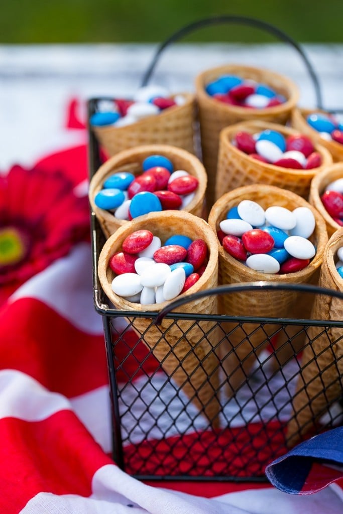 Ice cream cones filled with red white & blue M&M's.