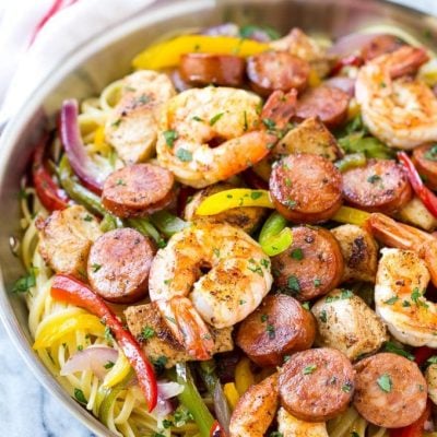 This recipe for Cajun jambalaya pasta is full of andouille sausage, shrimp, Cajun spiced chicken and vegetables, all served over creamy pasta. A hearty meal that's perfect for an everyday dinner or for entertaining! #savoryoursummerrecipes #ad