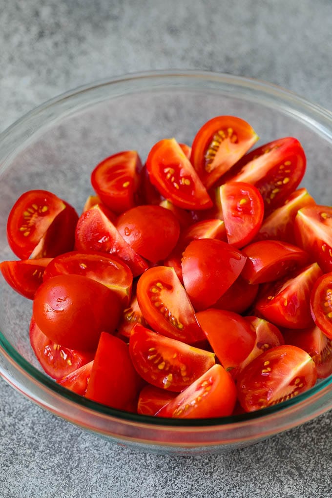 Quartered tomatoes in a bowl.