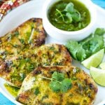 This recipe for cilantro lime chicken is marinated grilled chicken that's topped with a zesty cilantro lime sauce. The perfect quick and easy way to spice up your grilled chicken! #ConquerTheExpected #ad