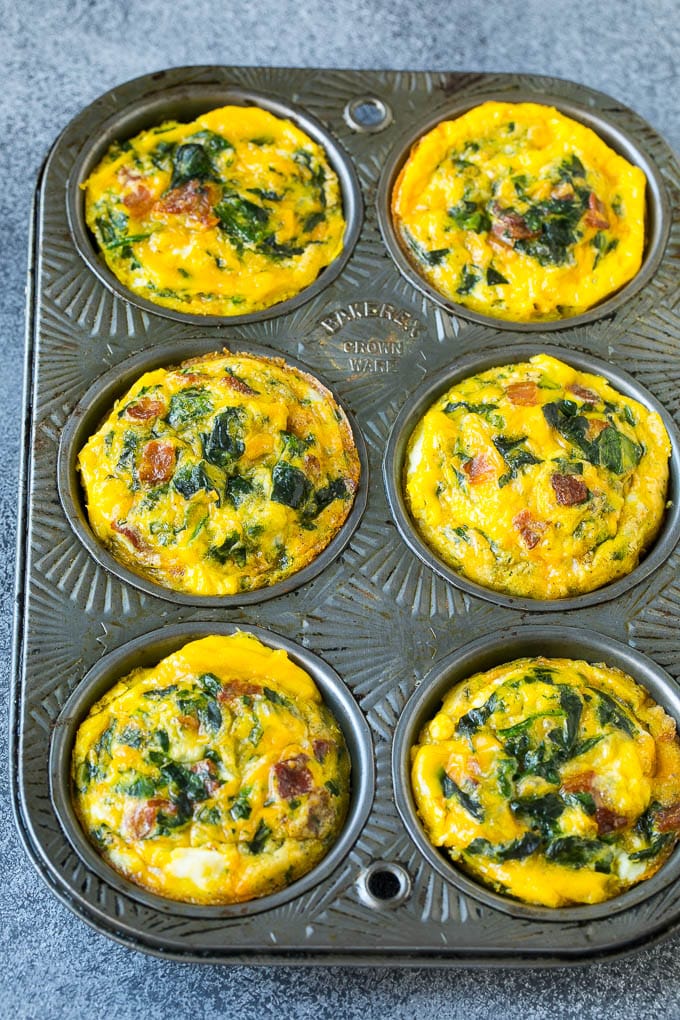 Baked egg muffins made with bacon and spinach.