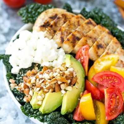 This recipe for Tuscan kale salad is full of kale, grilled chicken, avocado, tomatoes, almonds and feta cheese, all tossed in a simple lemon dressing. An easy and healthy meal! #LaneToGreatness #ad