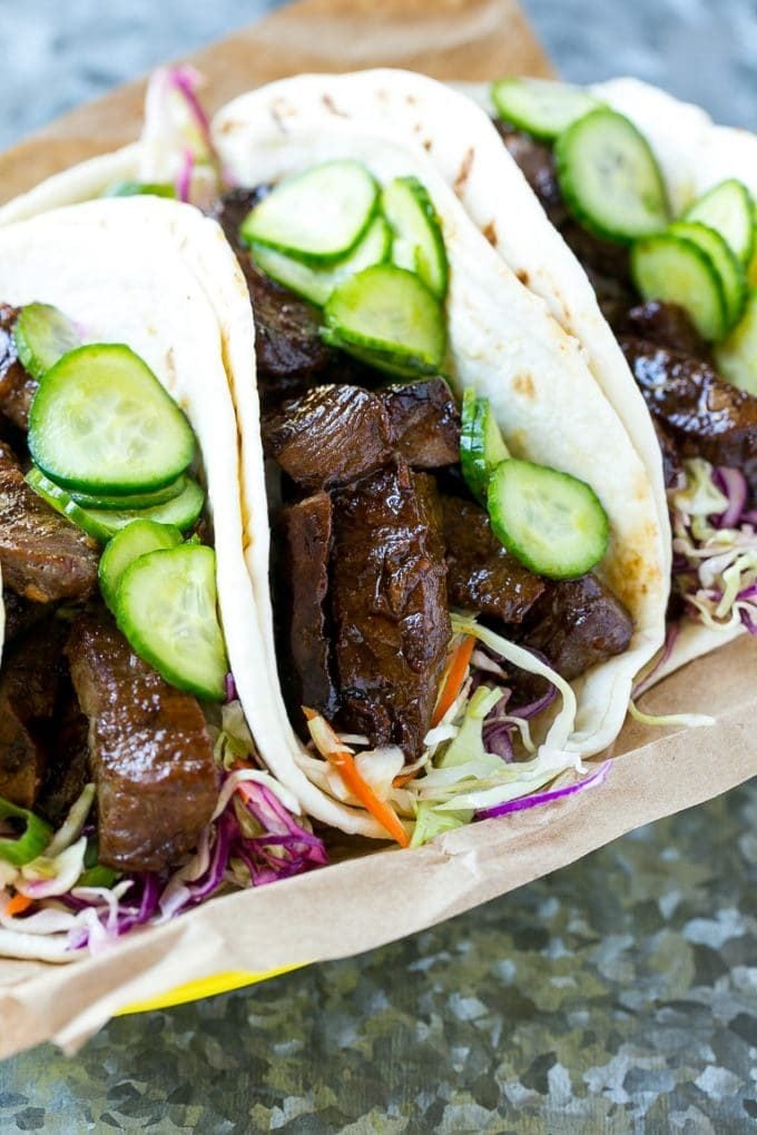 Korean BBQ tacos with cabbage and pickled cucumbers.