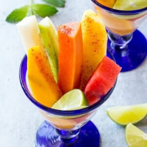 This recipe for Mexican fruit cups is spears of tropical fruit, stacked in a glass and sprinkled with chile lime seasoning. A refreshing and unique take on fruit salad!