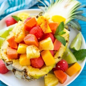 This recipe for Mexican fruit salad is a blend of tropical fruit topped with chili lime seasoning - a sweet and savory delight that everyone will want seconds of!