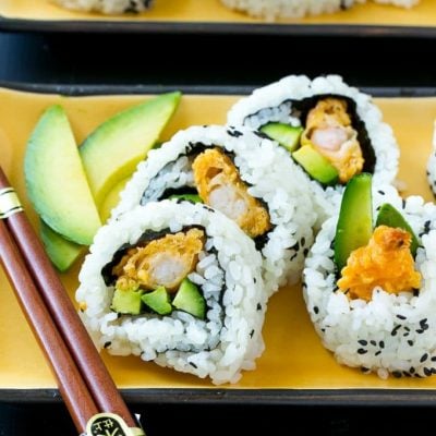 This recipe for shrimp tempura roll is crispy shrimp with avocado and cucumber, all wrapped up in seasoned rice. Making sushi at home is actually quite fun and easy to do!