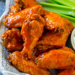 Baked buffalo wings tossed in hot sauce, served with celery sticks.