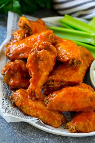 Baked buffalo wings tossed in hot sauce, served with celery sticks.