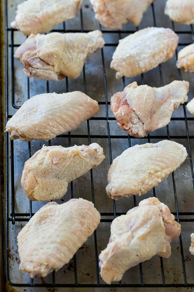 Chicken wings on a baking rack.