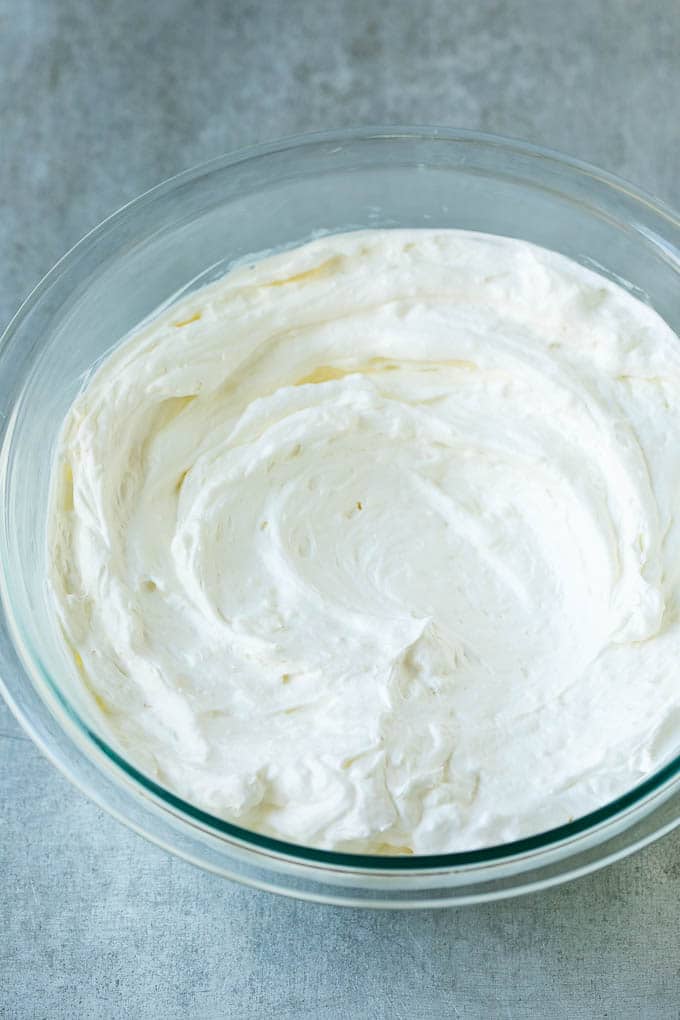 Cream cheese, marshmallow cream and whipped topping in a mixing bowl.